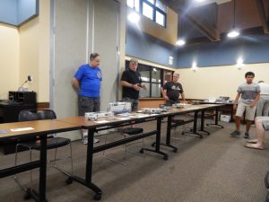 President Mike O'Leary (center) brings the meeting to order with Vice-Presidents Bob Ekstrom (L) and David Nielsen (R)