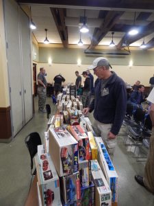Club members look through the auction entries prior to the meeting