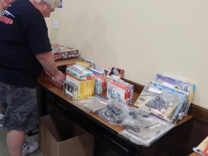 Secretary Joel Hendricks arranges some of the auction entries