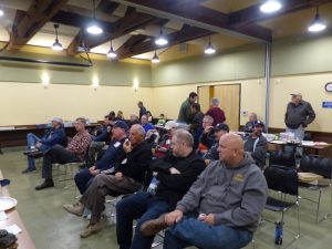 The members of the club await the start of the meeting