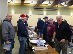 The members of the club peruse the models brought in for display
