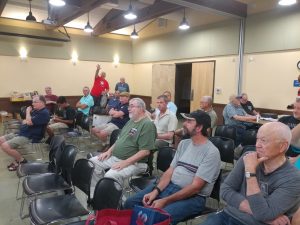 Members of the club eagerly await the start of the meeting