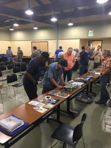 Members took time during the break to inspect the models