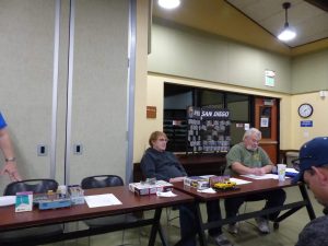 Club Officers prepare for the meeting.