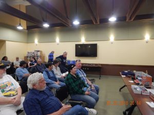 Members of the club await the start of the meeting. Members of the club await the start of the meeting.