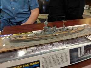 Jerry Jackson brought in this 1-700 Trumpeter HMS Queen Elizabeth. He applies white paint to the ends of his rigging lines before adding them, clipping the ends off once finished.