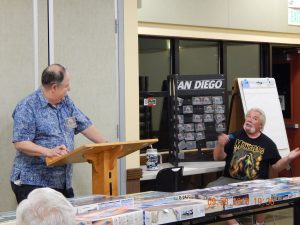Secretary Joel Williams gives his report and explains the unusual rules for this month's OrangeCon