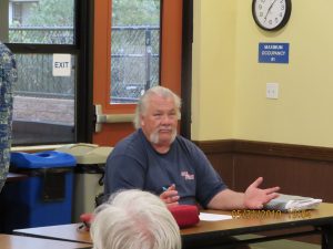Secretary Joel Hendrick gives his report to the club