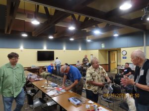 Members of the group discuss models before the meeting